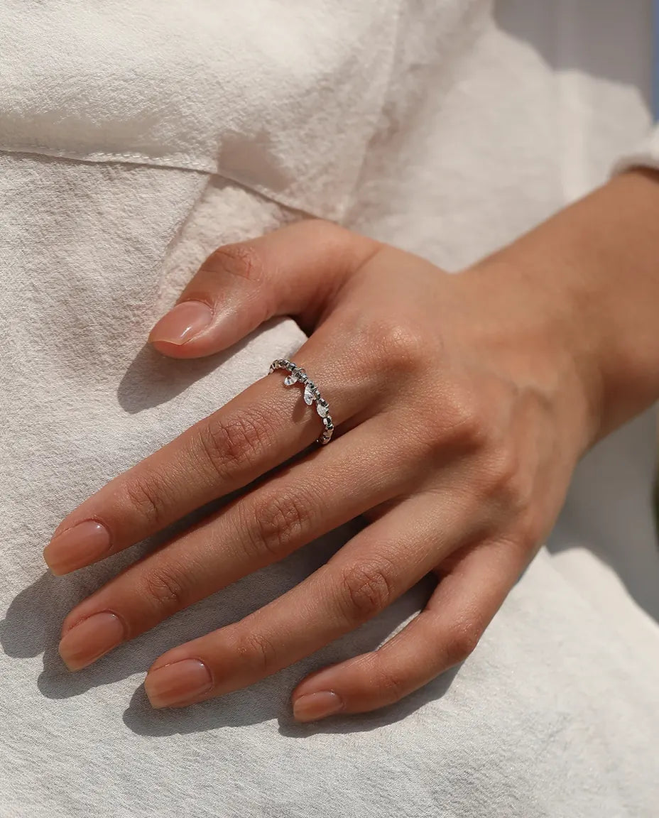 Dangle moissanite ring with three swinging stones on adjustable beaded silver band