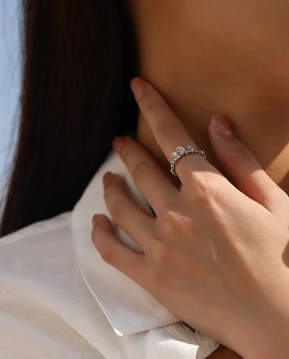 Dangle moissanite ring with three swinging stones on adjustable beaded silver band