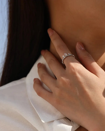 Dangle moissanite ring with three swinging stones on adjustable beaded silver band