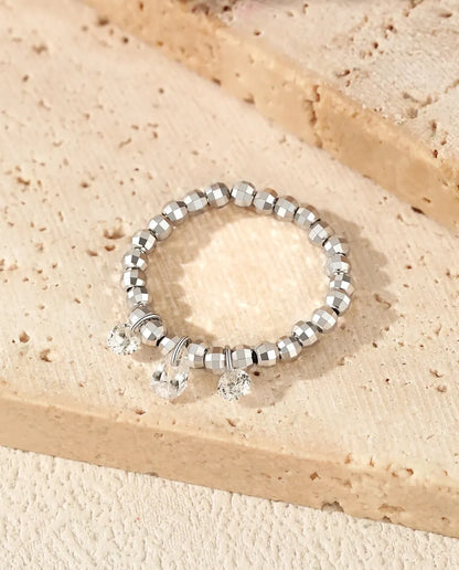 Dangle moissanite ring with three swinging stones on adjustable beaded silver band