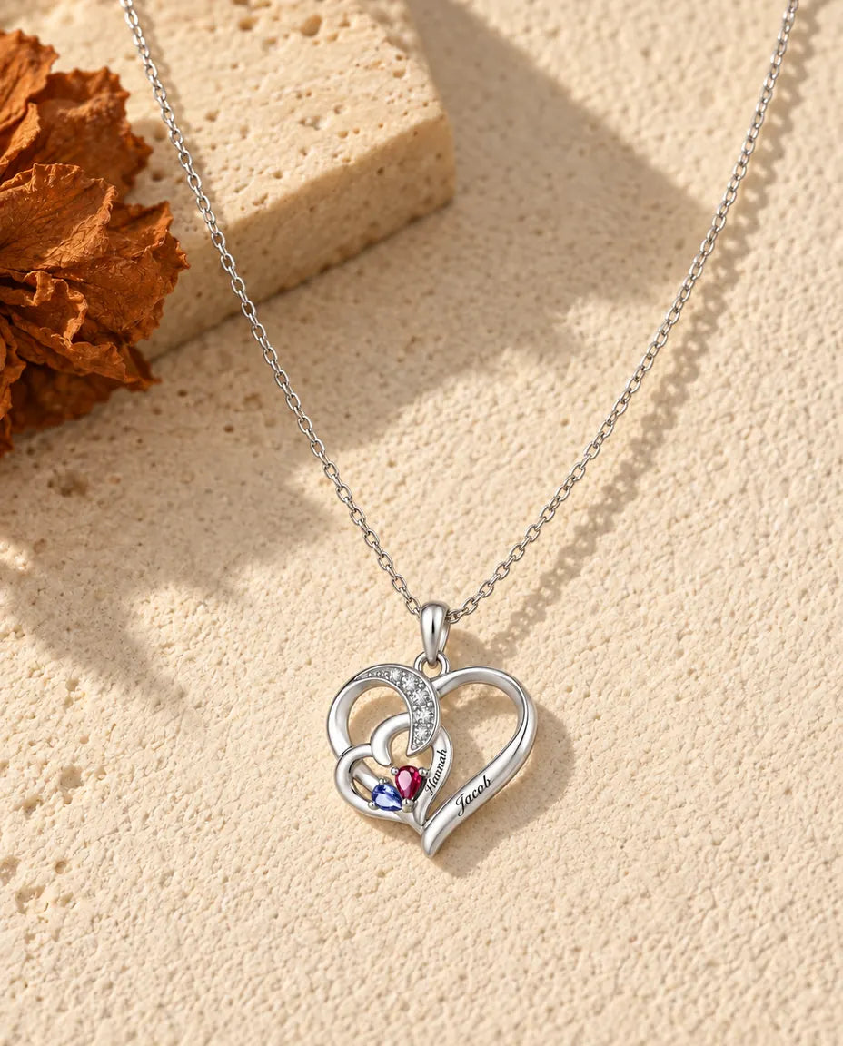 Silver interlocking heart necklace with two pear birthstones and two engraved names