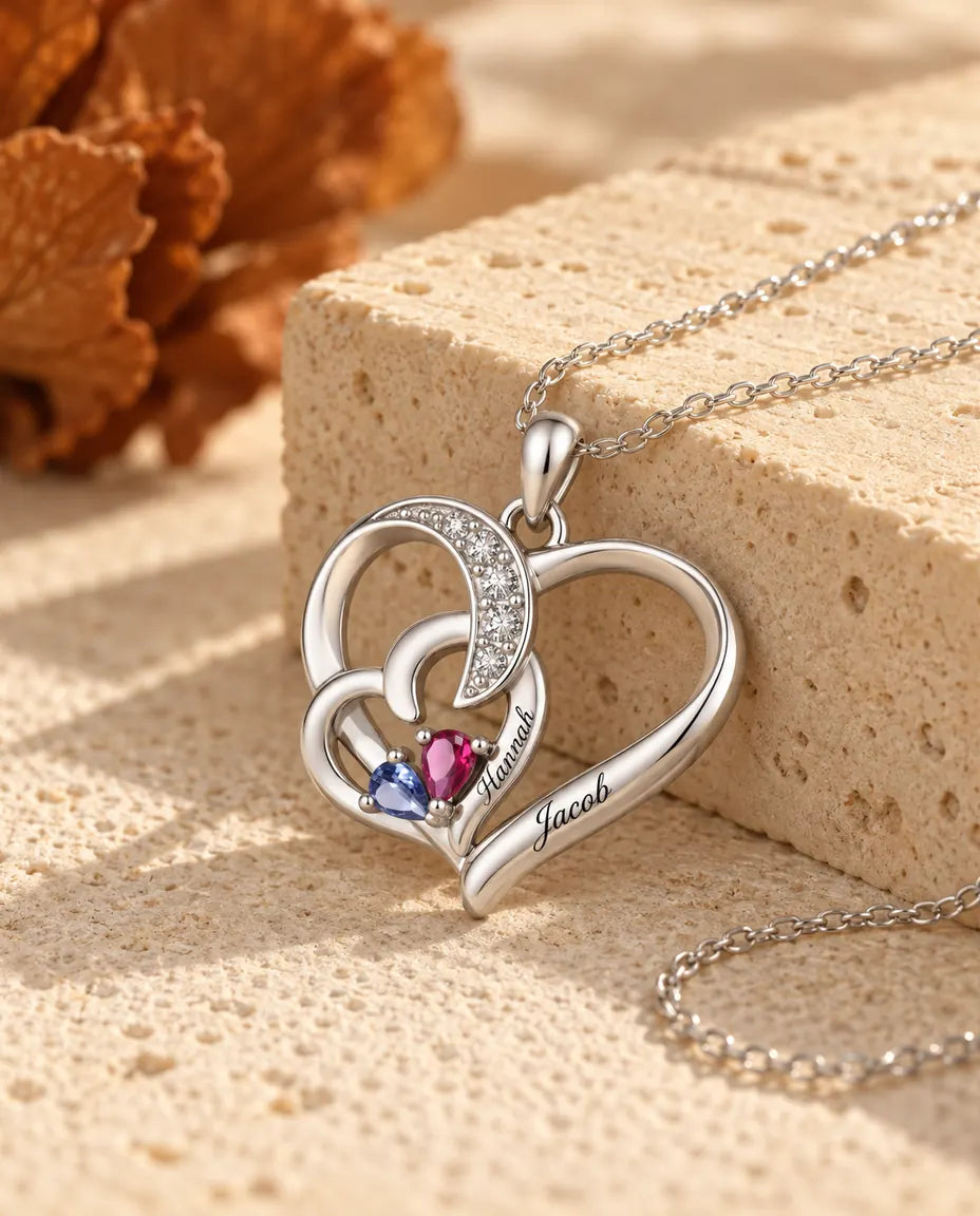 Interlocking heart necklace photographed from a low angle