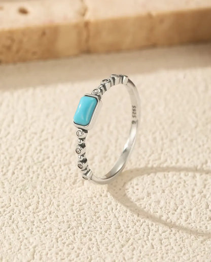Turquoise cabochon ring on beaded bezel band in 925 sterling silver