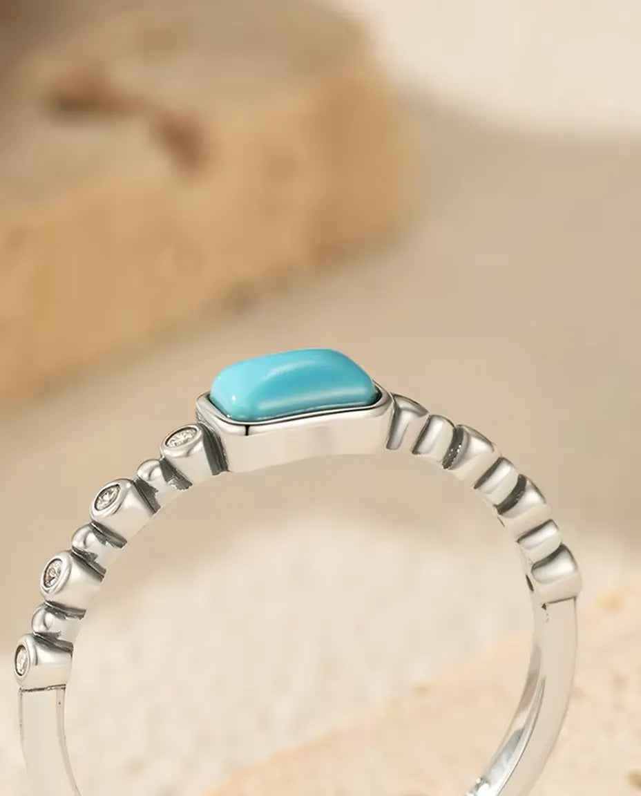 Turquoise cabochon ring on beaded bezel band in 925 sterling silver