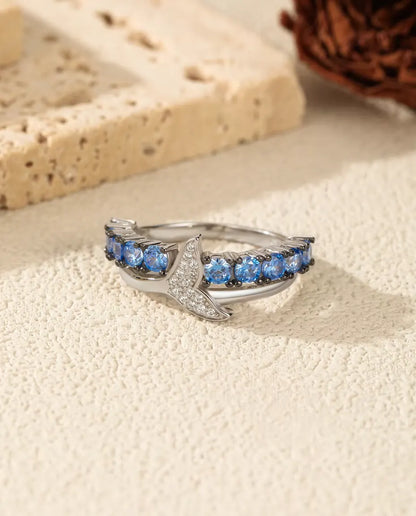 Whale tail ring with blue and white zirconia in 925 sterling silver