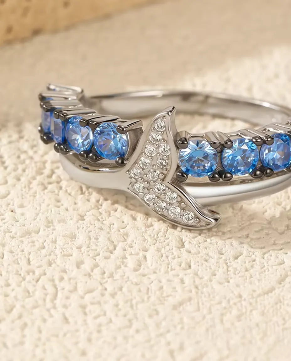 Whale tail ring with blue and white zirconia in 925 sterling silver