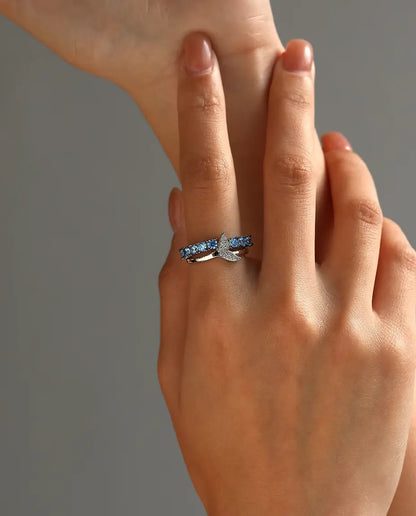 Whale tail ring with blue and white zirconia in 925 sterling silver