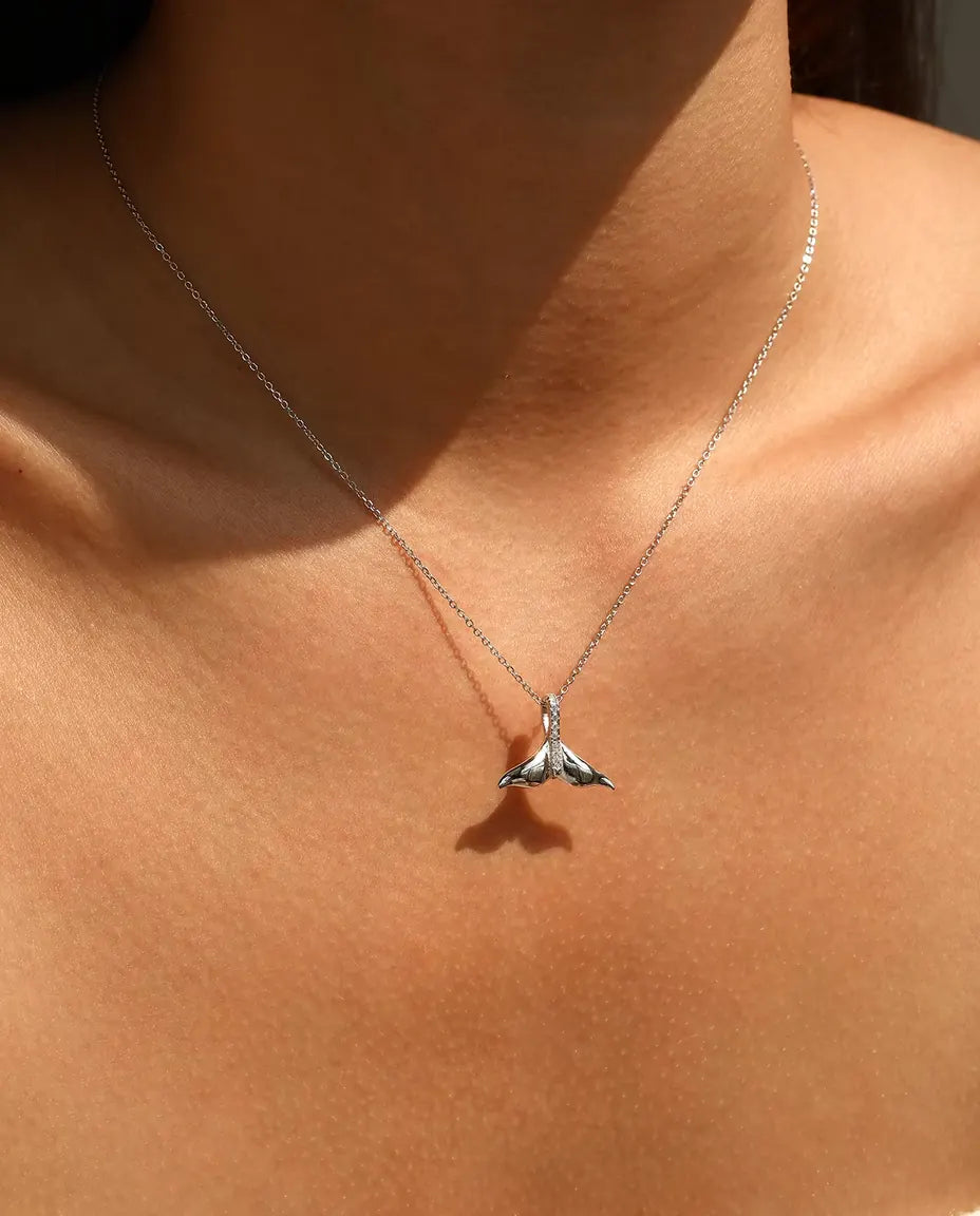 Whale tail pendant necklace in 925 sterling silver with a pave set bail
