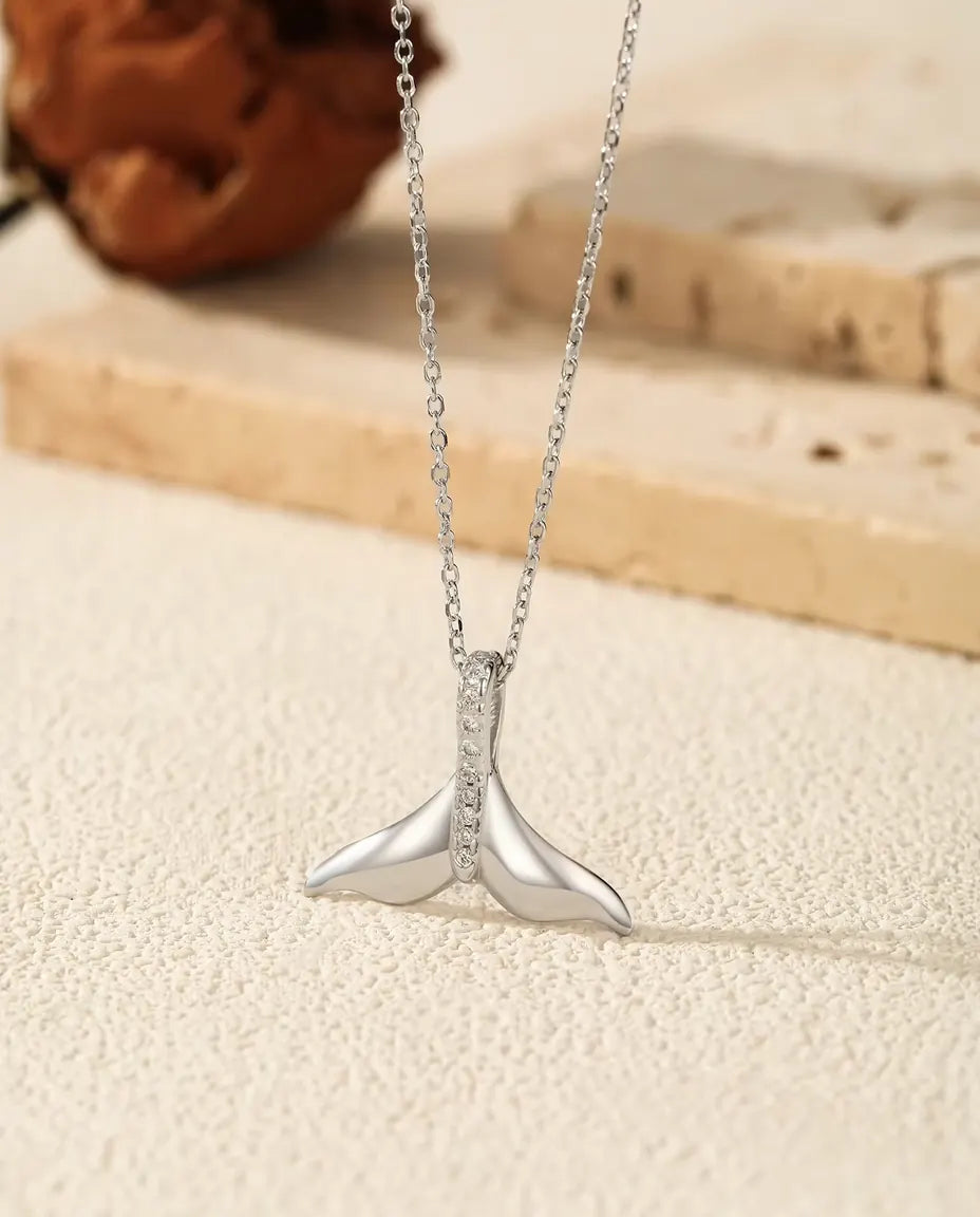 Whale tail pendant necklace in 925 sterling silver with a pave set bail