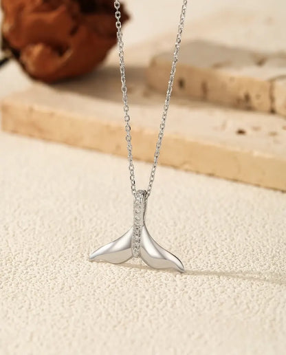 Whale tail pendant necklace in 925 sterling silver with a pave set bail